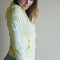 Yellow unisex organically made zip up hoodie with white details