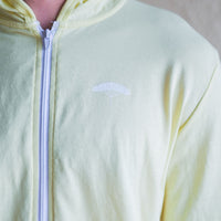 Yellow unisex organically made zip up hoodie with white details
